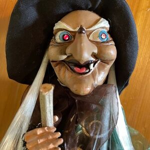 Flying eye flashing cackling fashionable animated Halloween witch